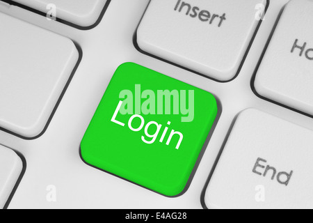 Green button with login word on computer keyboard background Stock Photo