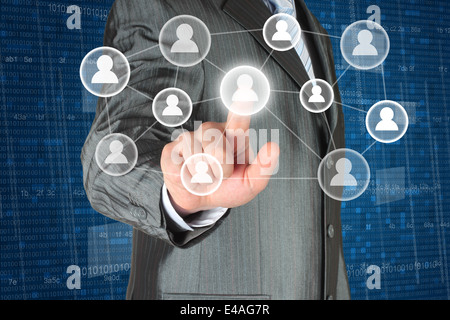 Businessman with hand pressing virtual social media button on digital background Stock Photo