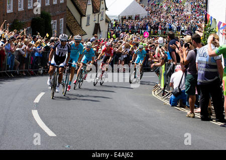 Finchingfield, Essex, UK. 07th July, 2014. The Tour de France stage from Cambridge to London runs through the picturesque Essex village of Finchingfield.  Cyclists race up a hill on Wethersfield Road Credit:  William Edwards/Alamy Live News Stock Photo