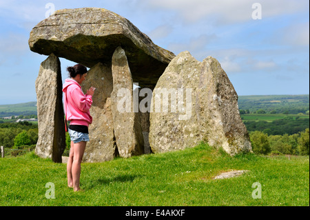Woman in front of Pentre Ifan burial chamber, north Pembrokeshire, Wales UK Stock Photo