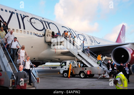 Passengers dis-embarking from  Virgin Atlantic Boeing 747- 400 Aircraft at Grantley Adams International Airport, Barbados Stock Photo