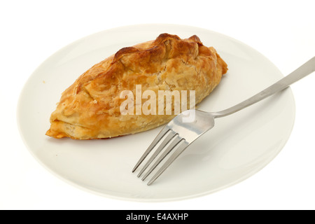 Cornish pasty on a white plate with a fork Stock Photo