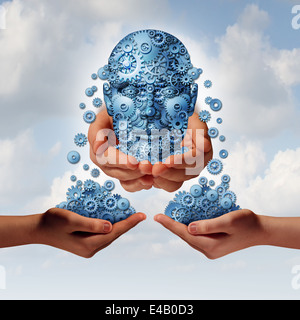 Success tools busiiness concept as a group of gearsand cogs shaped as a human head giving and sharing financial and industry information to partners with their hands open as a metaphor for training and skills education. Stock Photo