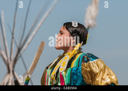 Female dancer in jingle dance regalia, Pow-wow, Blackfoot Crossing Historical Park, Alberta, Canada Stock Photo