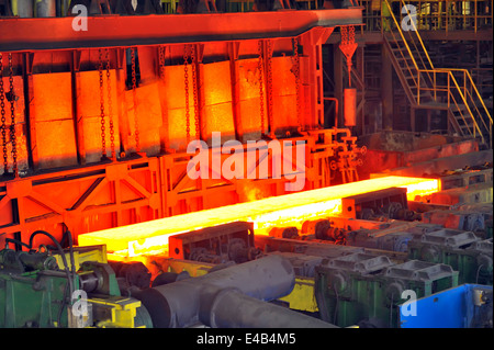 hot steel on conveyor in plant Stock Photo