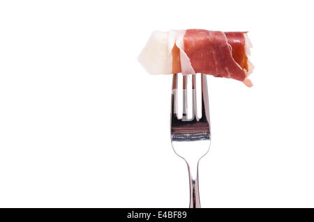 Melon with parma ham on a fork Stock Photo