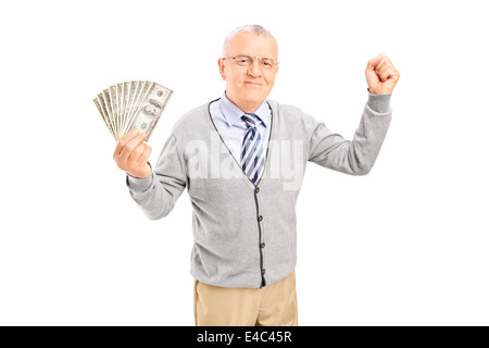 Overjoyed senior holding cash and gesturing happiness Stock Photo