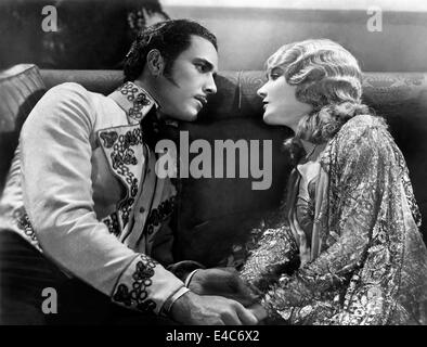 Don Alvarado, Mary Philbin, on-set of the Silent Film, 'Drums of Love', 1928 Stock Photo