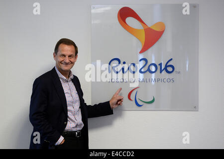 President of the German Olympic Sports Federation (DOSB), Alfons Hoermann, poses in front of the logo of the Rio de Janeiro Paralympics during a visit the Olympic base in Potsdam, Germany, 08 July 2014. Photo: RALF HIRSCHBERGER/dpa Stock Photo