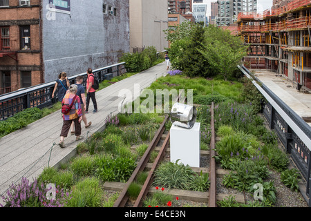 Pedestrians walk on High Line Park in the New York City borough of Manhattan, NY Stock Photo