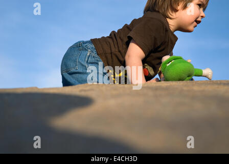 Three Year Old Boy Playing on Playground at Waterfront Park in Louisville Kentucky Stock Photo