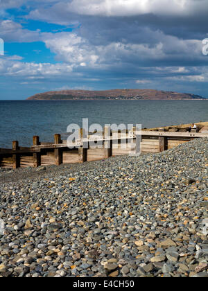 View across the sea towards the Great Orme and Llandudno from the beach at Penmaenmawr on the North Wales coast Conwy UK Stock Photo