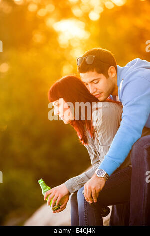 Happy young couple drinking beer together, Osijek, Croatia Stock Photo