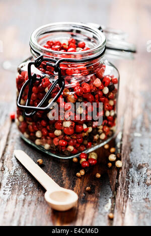 Colored Peppers Mix over wooden background Stock Photo