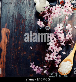 Spa setting with cherry blossoms  over wooden background Stock Photo