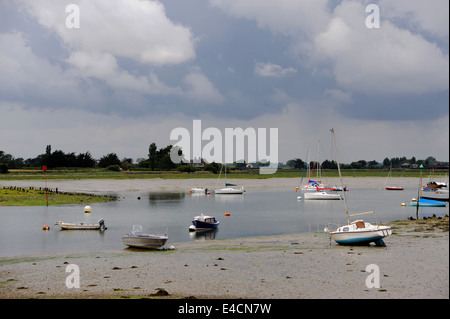 Bosham West Sussex UK - Bosham harbour with boats moored on the mud at low tide near Chichester Stock Photo