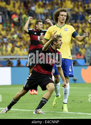 Belo Horizonte, Brazil. 8th July, 2014. Germany's Thomas Muller (front) celebrates after scoring during a semifinal match between Brazil and Germany of 2014 FIFA World Cup at the Estadio Mineirao Stadium in Belo Horizonte, Brazil, on July 8, 2014. Credit:  Qi Heng/Xinhua/Alamy Live News Stock Photo