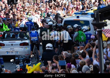 Mark Cavendish is helped back onto his bike after falling yards from the finish in Harrogate. Tour de France Stock Photo