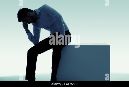 Exhausted miserable guy with big problem Stock Photo