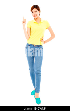 smiling young woman standing and make a gesture Stock Photo