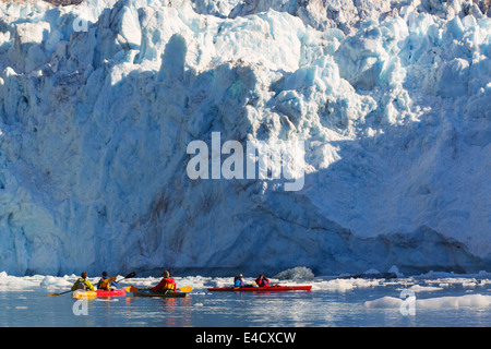 Kayaking in front of Barry Glacier, Harriman Fjord, Prince William Sound, Chugach National Forest, Alaska. Stock Photo