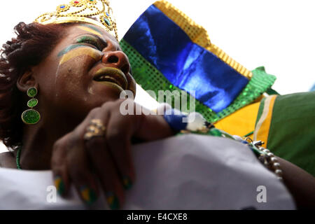 Sao Paulo. 08th July, 2014. A Brazil's fan reacts while watching a semifinal match between Brazil and Germany of 2014 FIFA World Cup at the FIFA Fan Fest in Sao Paulo, Brazil, on july 08, 2014. Credit:  Rahel Patrasso/Xinhua/Alamy Live News Stock Photo