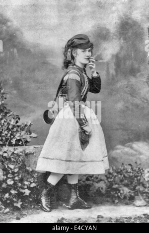 Lotta Crabtree, full-length portrait in costume for a theatrical role, smoking a cigar, circa 1868 Stock Photo