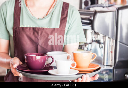 Barista preparing set of freshly brewed coffee for serving, stock photo Stock Photo
