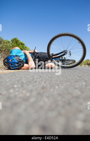 Road accident with injured cyclist lying on the pedestrian crossing ...