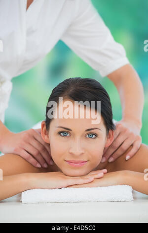 Beautiful brunette enjoying a shoulder massage Stock Photo - Alamy