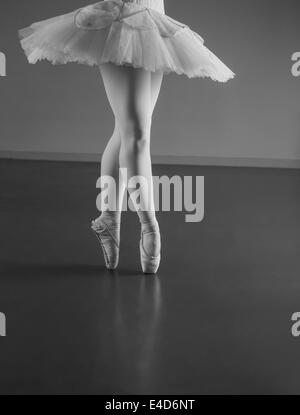 Graceful ballerina standing en pointe Stock Photo