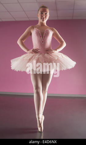 Graceful ballerina standing en pointe Stock Photo