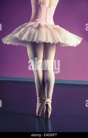 Graceful ballerina standing en pointe Stock Photo