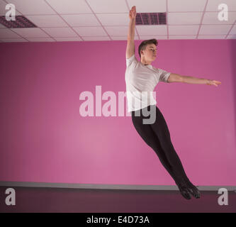 Focused male ballet dancer leaping up Stock Photo