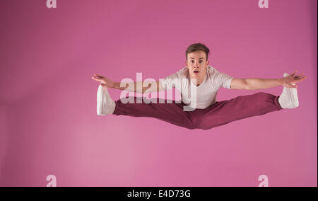 Cool break dancer mid air doing the splits Stock Photo