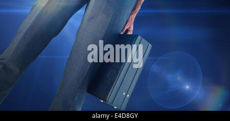 Composite image of businessman holding briefcase Stock Photo