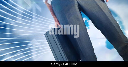 Composite image of businessman holding briefcase Stock Photo