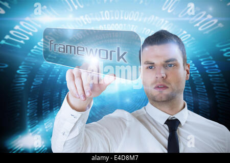Businessman pointing to word framework Stock Photo