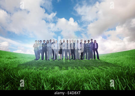 Composite image of business people standing up Stock Photo