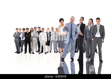 Composite image of multiethnic business people standing side by side ...