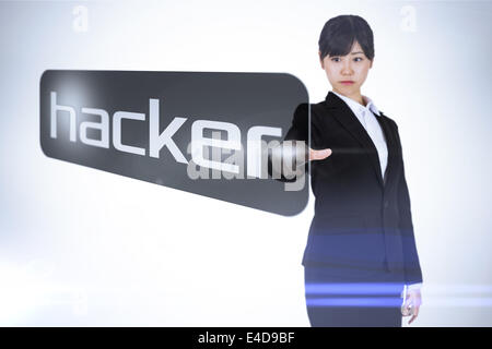 Businesswoman pointing to word hacker Stock Photo