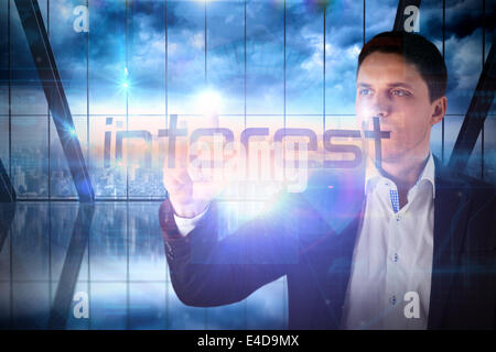 Businessman presenting the word interest Stock Photo