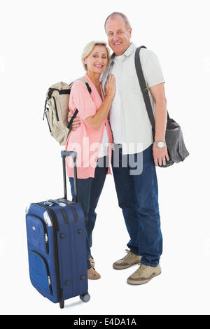 Smiling older couple going on their holidays Stock Photo