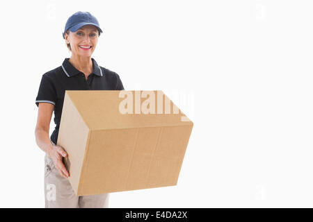 Happy delivery woman holding cardboard box Stock Photo