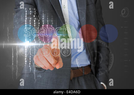 Businessman touching the word search on interface Stock Photo