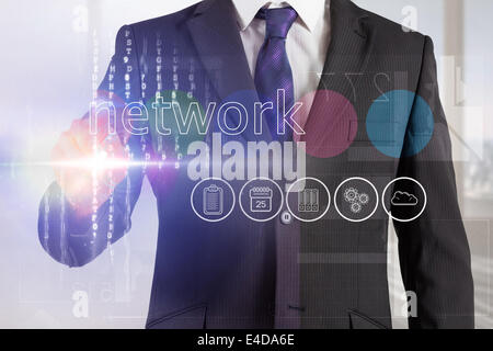 Businessman touching the word network on interface Stock Photo