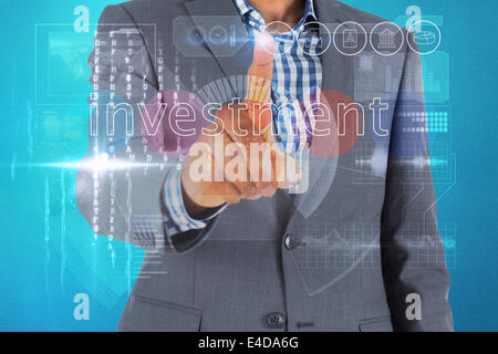 Businessman touching the word invest on interface Stock Photo