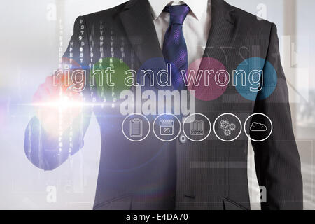 Businessman touching the words right and wrong on interface Stock Photo