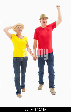 Mature couple walking and holding hands Stock Photo