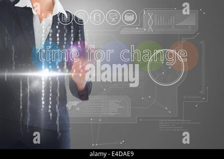 Businesswoman touching the words time for change on interface Stock Photo